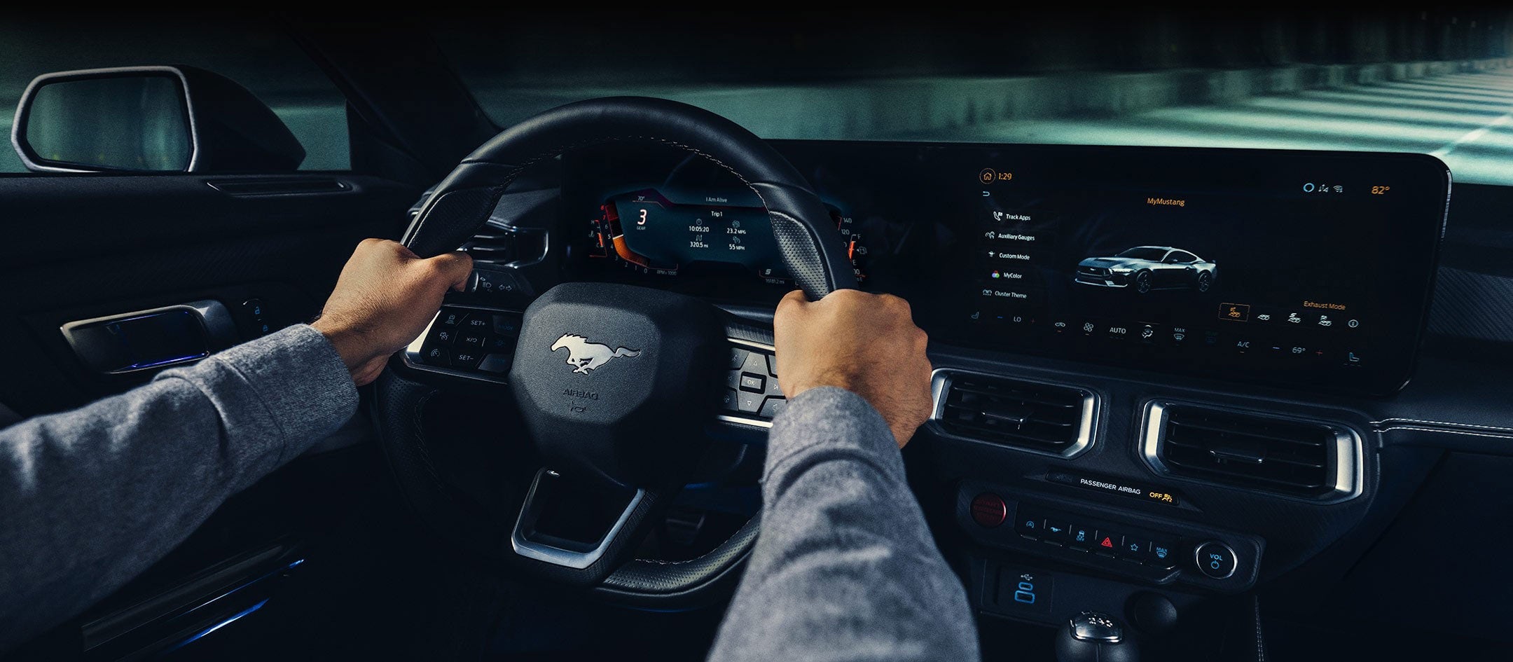 A 2024 Ford Mustang® model interior with a person driving | Rydell Ford in Independence IA