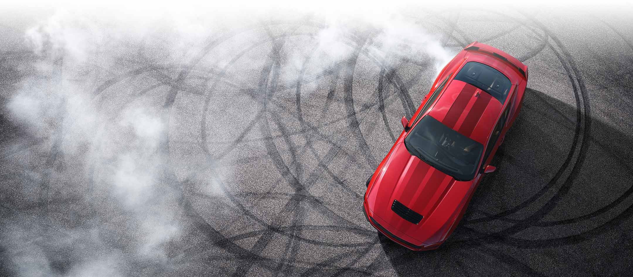 Overhead view of a 2024 Ford Mustang® model with tire tracks on pavement | Rydell Ford in Independence IA